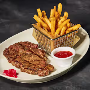 STK Steakhouse signature dishes Dry-Aged Tomahawk 34 ozSteak FritesPull Apart Bread